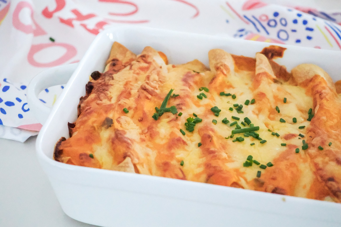 A long-time family favourite, these creamy and cheesy chicken enchiladas are so easy to make and perfect for a comforting weeknight dinner.