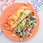 A long-time family favourite, these creamy and cheesy chicken enchiladas are so easy to make and perfect for a comforting weeknight dinner.