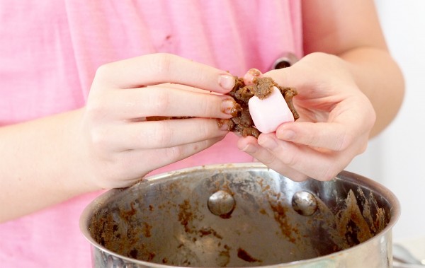 Marshmallow balls have a sweet biscuit mixture coating marshmallows, a delicious snack idea.