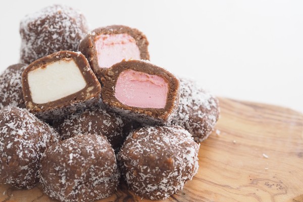 Marshmallow balls have a sweet biscuit mixture coating marshmallows, a delicious snack idea.