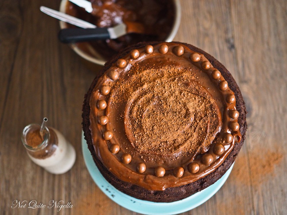 MILO AND WHISKEY CAKE - Looking for a delicious cake that doesn't hold back in a rich chocolatey malt flavour? This triple layer cake is your best bet! It's an incredibly rich cake with plenty of dark chocolate enriched with whisky. And the frosting? Well, it's a gorgeous and spreadable chocolate fudge frosting that is easy to make! 