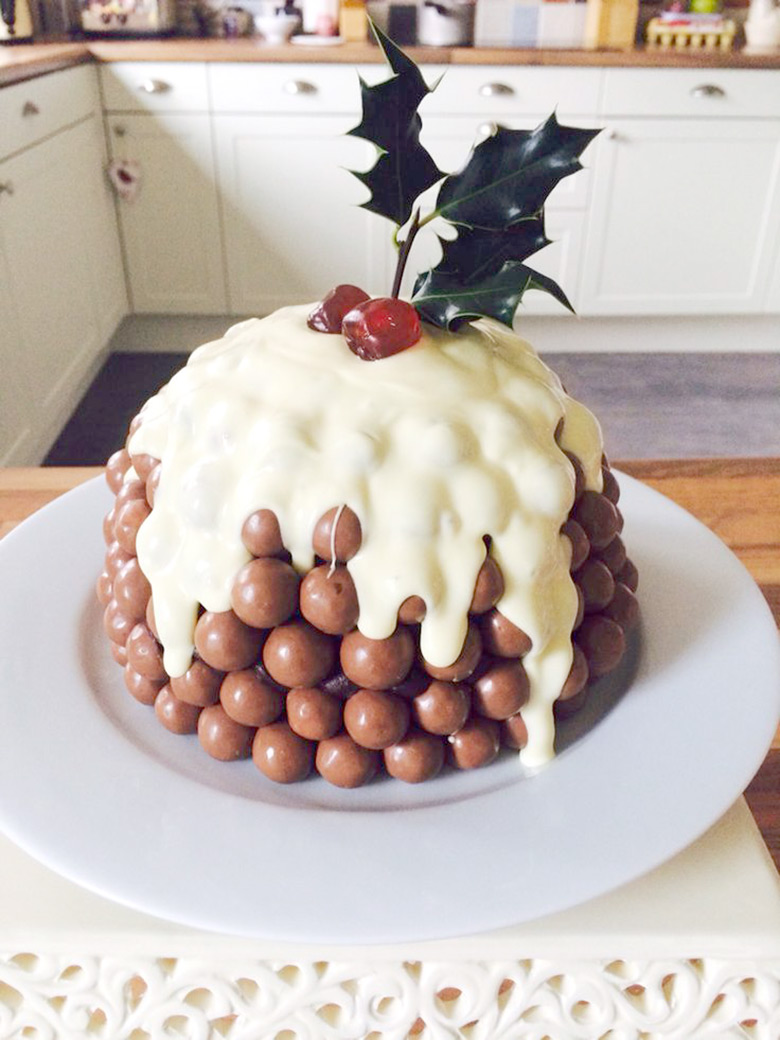 This Christmas Malteser Cake recipe is a a fun and chocolatey modern version of a Christmas Pudding.