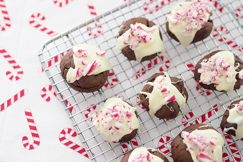 If you like Candy Canes and chocolate, you'll love these Chocolate Candy Cane Cookies. Drizzled with white chocolate and crushed candy canes they are sure to satisfy your chocolate cravings!