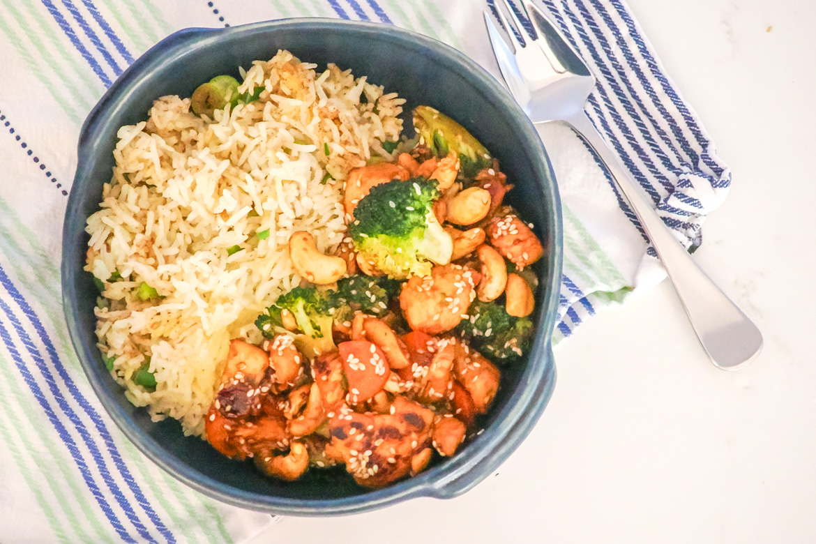 This easy spiced chicken stir fry with sesame and cashew rice is a quick, flavour-packed weeknight dinner. Customise with your favourite veggies – perfect for busy families!