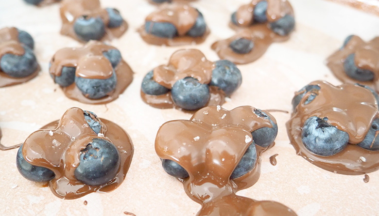 These three-ingredient Frozen Chocolate Blueberry Clusters make for a sweet treat with a healthy twist.