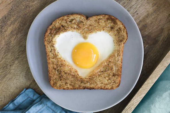 Heart shaped toast with egg and avocado