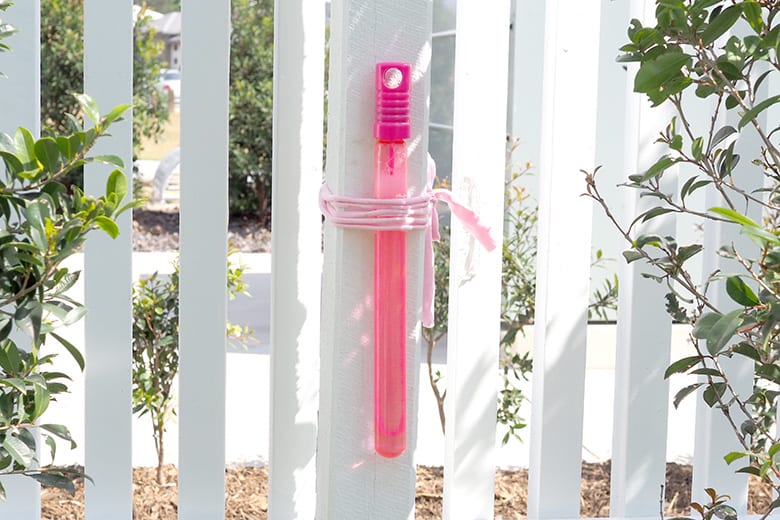 Attach bubble wand to post outdoors for no spills