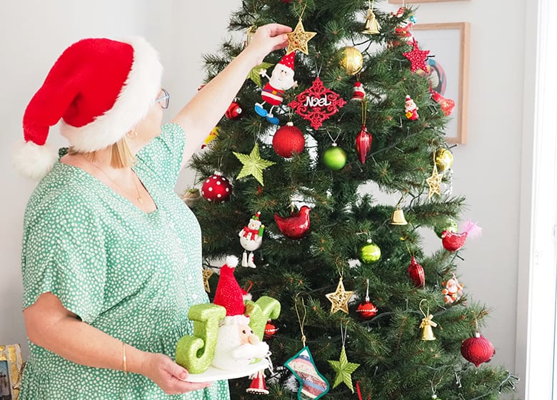 Kat with Christmas ornaments and decor