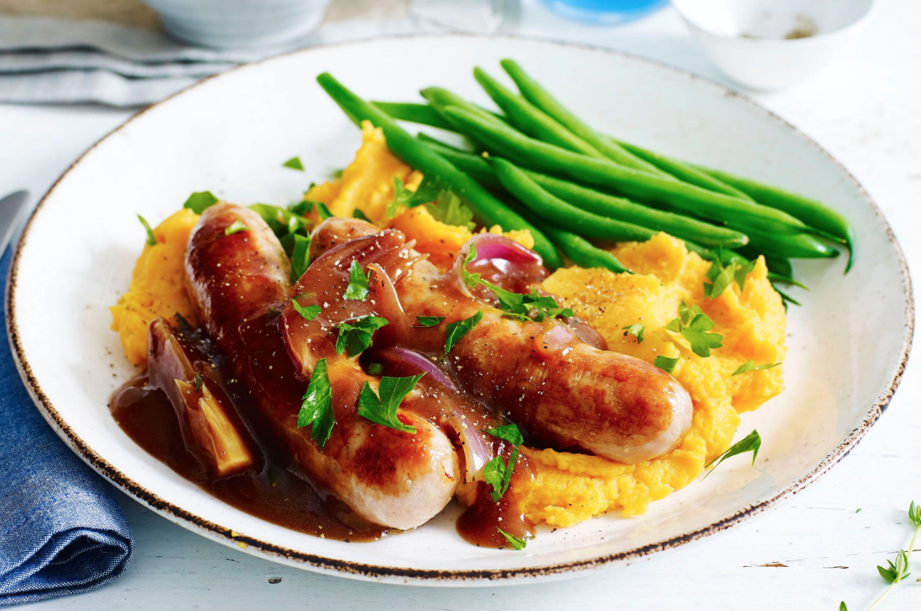 Bangers and sweet potato mash with beans and gravy