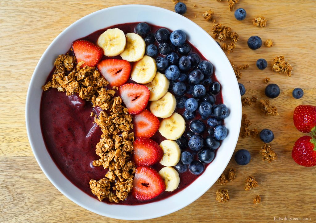 acai bowl of granolia, strawberries, bananas and blueberries