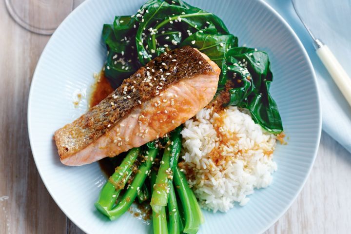 steamed salmon with a side of steamed vegetables of broccoli and rice 