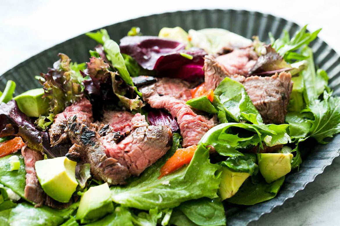 steak and salad with avocado, beetroot and salad