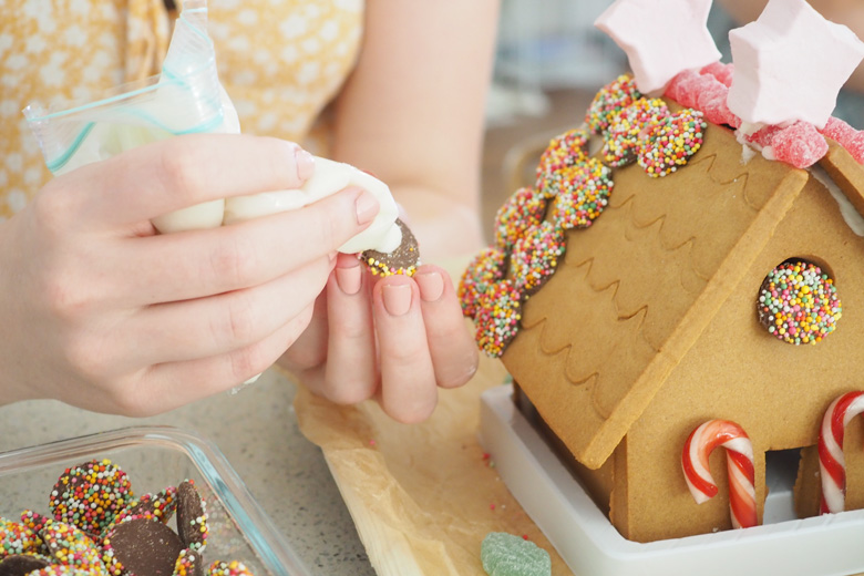 decorating a gingerbread house