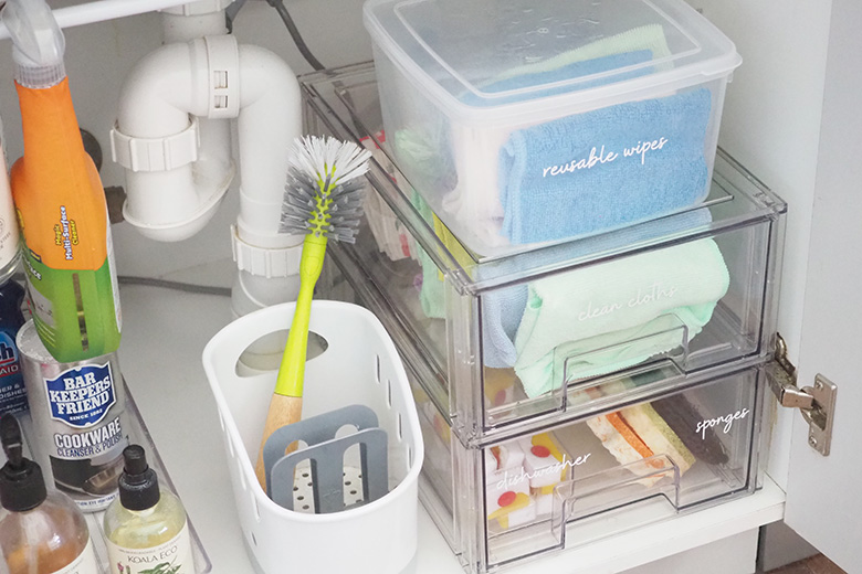 how to organise under the kitchen sink cupboard